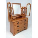 A late 19thC Arts and Crafts dressing table with 2 arch shaped hinged mirrors and central squared