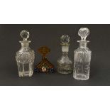 A group of 4 cut glass scent bottles including a 1930s Hoffman style Czech Art Deco amber cut