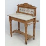 A Victorian stripped pine grey marble topped washstand with tile back 30 1/2" wide x 40" high