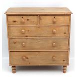 A late Victorian stripped pine chest of drawers comprising 2 short over 3 graduated long drawers