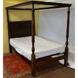 An 18thC and later oak and beech four poster 4ft bed with panelled headboard etc 48" wide x 73 3/