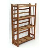 Bookshelf : an oak book dealers / antique dealers  folding bookcase  of four shelves with gated