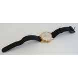 Wristwatch : a gold plated cased Artis 17 jewel manual Incabloc wristwatch with date at 3 and