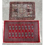 Carpets / Rugs : A hand woven woollen rug  with floral design incorporating two tree medallions on a