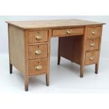 A mid 20thC blonde oak pedestal desk 48" wide x 26 3/4" deep  x 30" high  CONDITION: Please