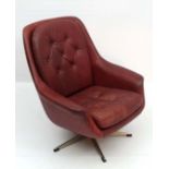 Vintage Retro : A Danish Sang De Beouf Leather covered swivel armchair, standing on a 5 chromed