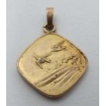 A gilt metal pendant with Japanese Aesthetic movement decoration depicting birds sea and waves.