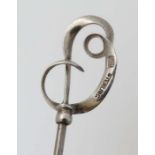 Hat Pin : A hat pin surmounted by a silver scroll and marked C.H Sterling. Probably by Charles