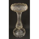 A Victorian clear glass waisted trumpet vase on pedestal base. 11 3/4'' high.  CONDITION: Please