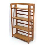Bookshelf : an oak book dealers / antique dealers  folding bookcase  of four shelves with gated