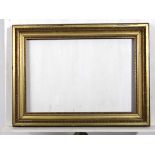 Frame : a gilt frame with egg and dart moulding , 4 1/3" wide, will fit 22 3/8 x 32 1/3" picture