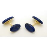 Trianon : A pair of gold cufflinks set with lapis lazuli marked 750 Trianon 27866.  CONDITION: