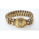 An American gold plated expanding bracelet with circular section. Marked ' Phoenix Speidel Made '.