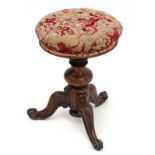A Victorian Rosewood tripod piano stool with overstuffed seat.  17 1/3" high  CONDITION: Please Note