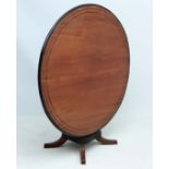 Anglo - Indian Table : a 19thC mahogany tilt top circular table with ebony stringing and border on a