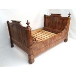 A 19thC French fruit wood bed with carved decoration to one side only ( for positioning the other