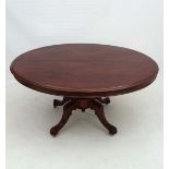 A Victorian oval mahogany Loo table standing on a four foot base 54" long x 42" wide  CONDITION: