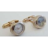 Gilt metal cuff links , one with inset Lodex watch face, the other a compass. Each approx 3/4" wide