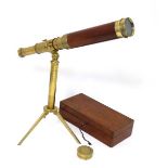 A 19thC Mahogany and brass 4-draw boxed telescope marked Carey  with brass tripod stand. Extends