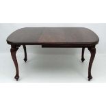 A c.1900 walnut wind out dining table with pad feet 41" wide x 57" extended  CONDITION: Please