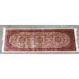 Rug / Carpet : a beige ground Keshan runner with red and black colours, Moorish doorway shaped and 3
