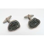 A pair of silver cufflinks set with semi-precious hardstone cross sections. Hallmarked London 1979