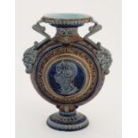 A late 19thC Sarreguemines Majolica two handled moon flask on pedestal base , number 523, having