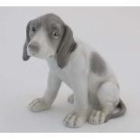 A late 19thh / early 20thC Gebruder Heubach hound figurine, having impressed mark and blue printed