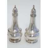 A Canadian Sterling silver unusual four piece cruet set comprising pair of peppers and pair of salt,