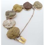 A gilt metal bracelet set with 6 lava cameo depicting various classical gentleman
 CONDITION: Please