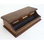 An early 20thC oak clerks lidded triple inkwell having copying, red and black ink. 9 3/8" wide