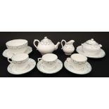 A late 19thC part tea set to include; teapot , 3 cups, 3 saucers, sucrier, slop bowl and 2 cake