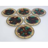 A set of 6 c1872 Wedgewood Majolica plates , decorated with brown yellow and green glaze, with