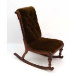 A mid Victorian walnut rocking (on bows)  nursing chair with button back upholstery 20 1/2" wide x