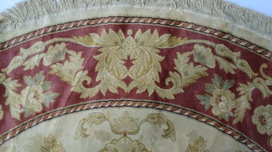 A late 20thC buff ground circular silk rug with rouge border. 84" diameter CONDITION: Please Note - - Image 4 of 7