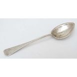 An early - mid 20thC Sterling Silver preserve spoon  marked ' Sterling ' Hand Wrought and marked