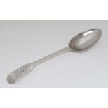 A Geo III silver fiddle pattern spoon. Hallmarked London 1818 maker Joseph Read. Approx 6 1/2"