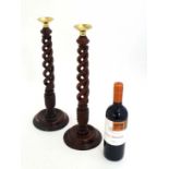 A pair of late 20thC turned wooden triple opentwist candlesticks 17 1/2" high  CONDITION: Please