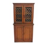 A Victorian pitch pine glazed top cabinet with leaded lattice work glass doors to top over 2