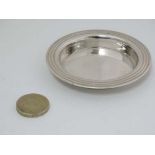 A silver plate pin dish of circular form marked under ' Asprey London ' 3" diameter CONDITION: