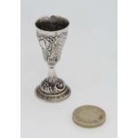 A Continental .800 silver  miniature  chalice  with engraved and embossed decoration. Indistinctly