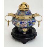 Cloisonné : An Oriental gilt and cloisonne tripod censor upon a wooden stand. 6 1/2" high