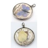 A double sided pendant/ locket with glazed central section containing pressed flower and butterfly