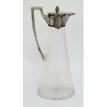 A Russian silver and glass claret jug  having star cuts under and with Russian silver mounts and