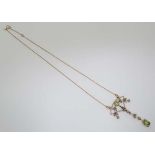 A 9ct gold necklace set with numerous peridot and diamonds. Approx 18” long  CONDITION: Please