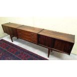 Vintage Retro :  a Danish rosewood? sideboard  of three sections on tapering four feet stand ,