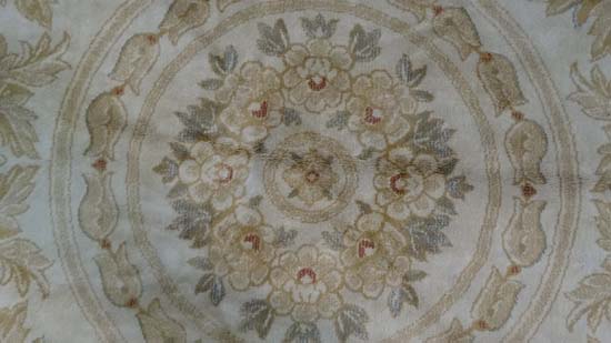 A late 20thC buff ground circular silk rug with rouge border. 84" diameter CONDITION: Please Note - - Image 3 of 7