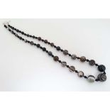 A bead necklace of graduated banded agate beads . Approx 26” long  CONDITION: Please Note -  we do