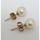 A pair of pearl stud earrings  CONDITION: Please Note -  we do not make reference to the condition