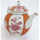 An 18thC polychrome tea pot decorated with vertical bands of pink floral sprays between panels of